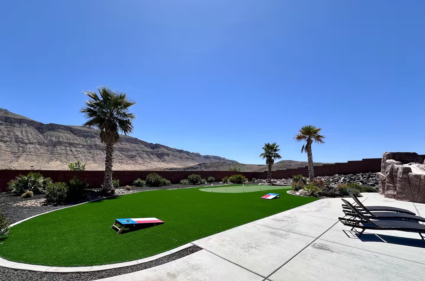 Putting green and cornhole at the group house